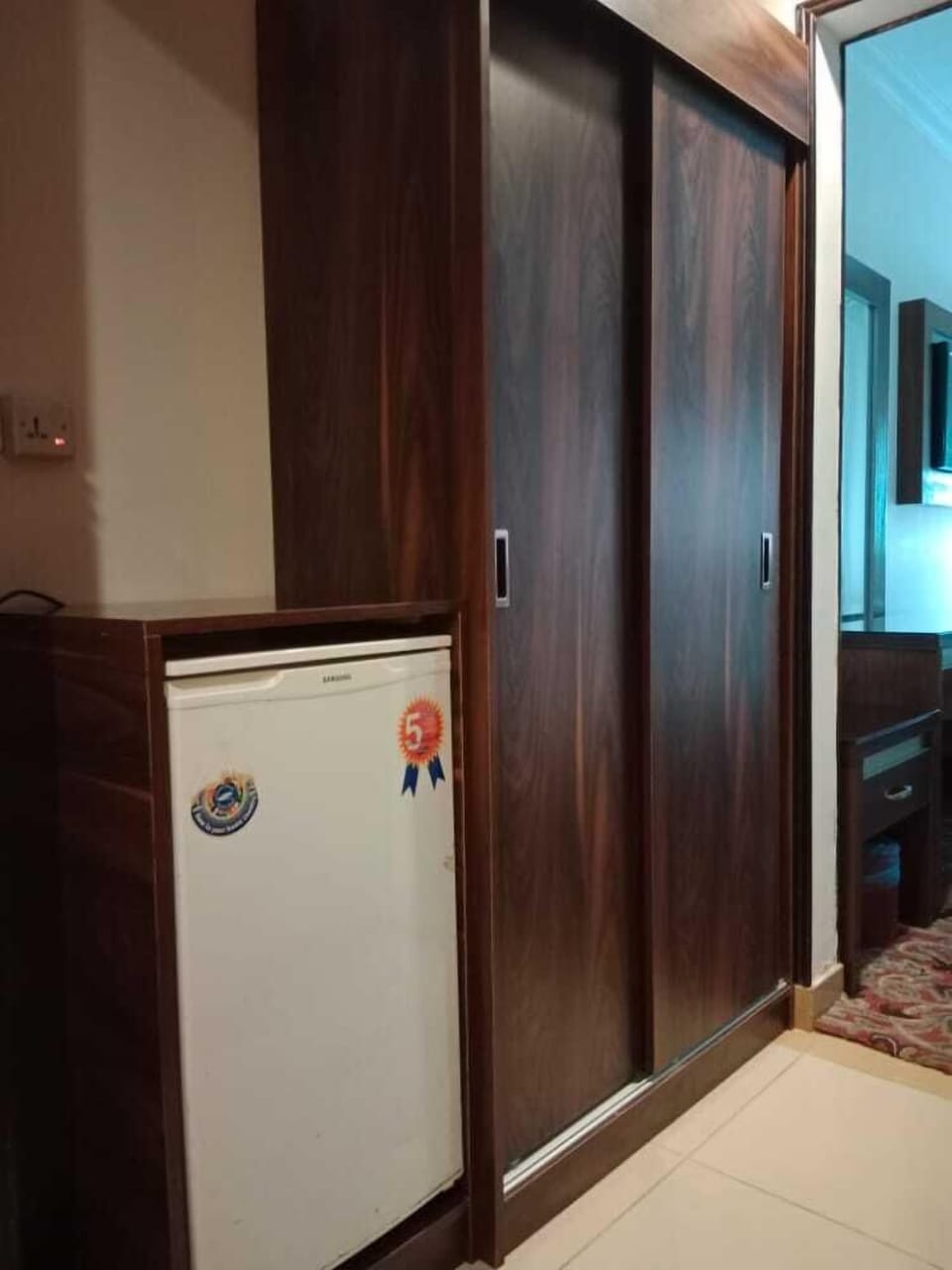Minibar, desk, bed sheets
