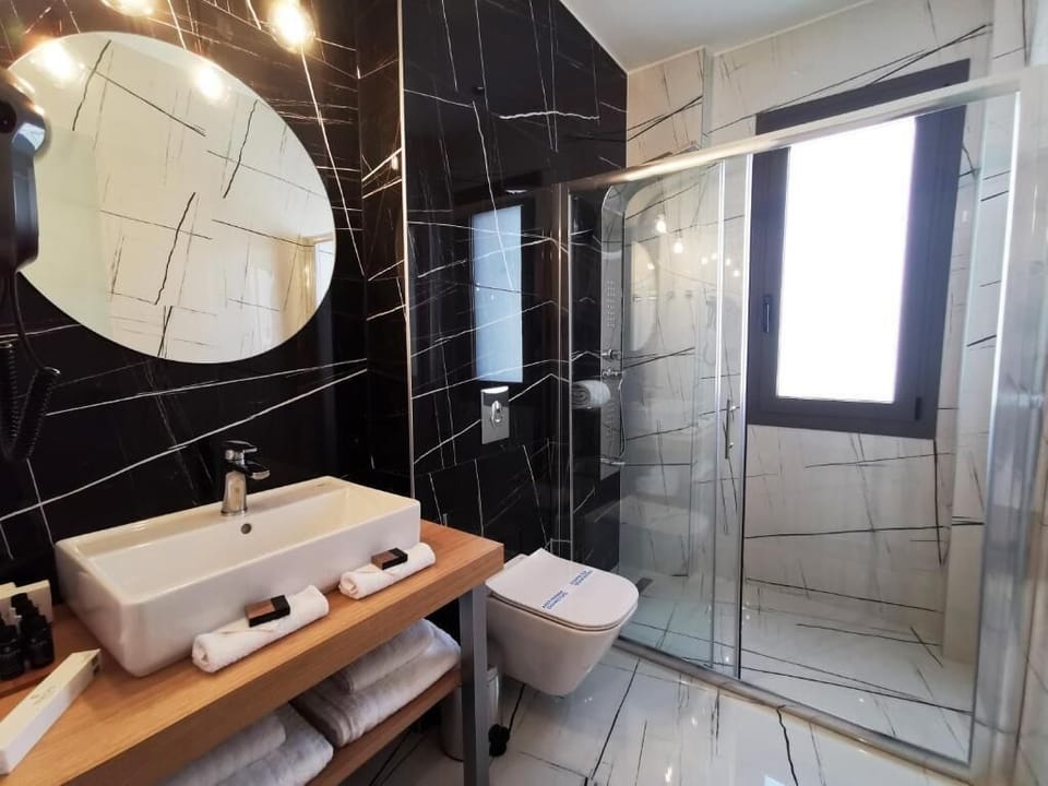 Shower, hydromassage showerhead, designer toiletries, hair dryer