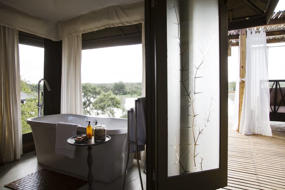 Luxury Tent | Bathroom amenities | Separate tub and shower, eco-friendly toiletries, hair dryer, bathrobes