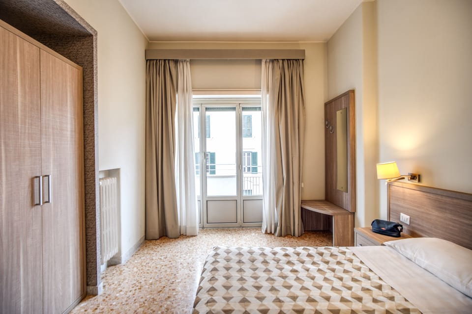 Deluxe Quadruple Room, Balcony | Hypo-allergenic bedding, desk, laptop workspace, soundproofing