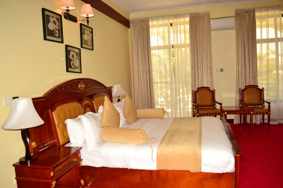 Executive Suite, 1 Bedroom, City View | Memory foam beds, individually decorated, desk, laptop workspace