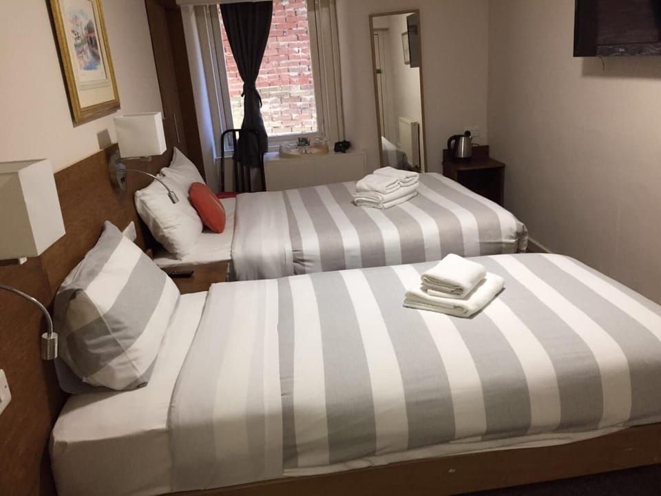 Blackout drapes, iron/ironing board, free WiFi, bed sheets