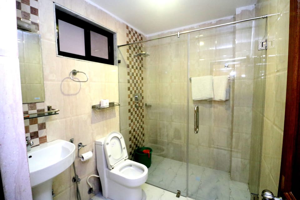 Shower, designer toiletries, hair dryer, bathrobes
