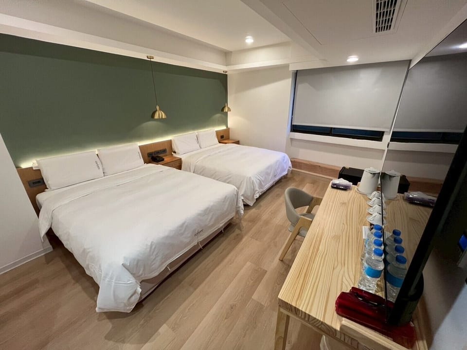 Family Quadruple Room, 2 Queen Beds | Down comforters, free minibar, desk, blackout drapes