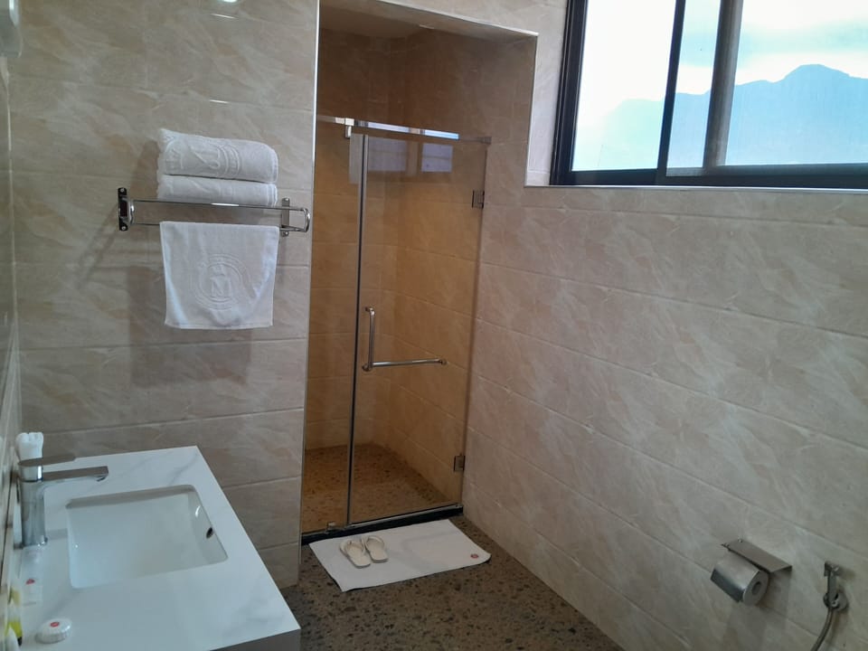 Deluxe Double Room, City View | Bathroom | Rainfall showerhead, free toiletries, hair dryer, bathrobes