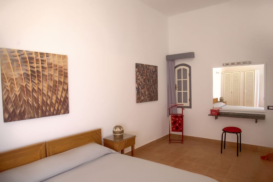Superior Suite, 1 Bedroom | Minibar, in-room safe, blackout drapes, iron/ironing board