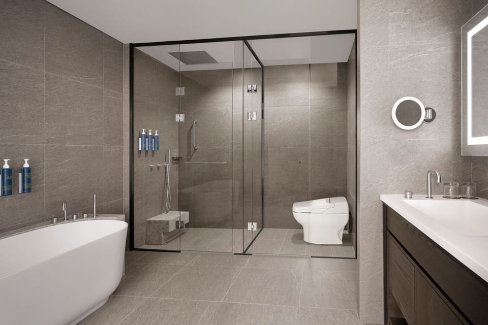 Suite, 1 King Bed, Park View | Bathroom | Hair dryer, slippers, bidet, towels