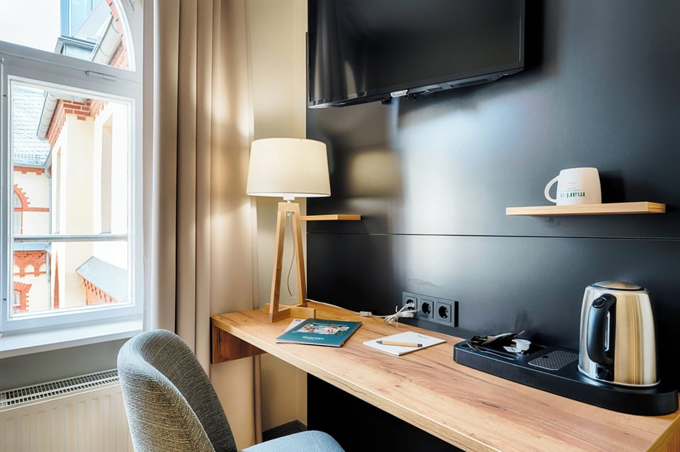 Desk, blackout drapes, WiFi (free), bed sheets
