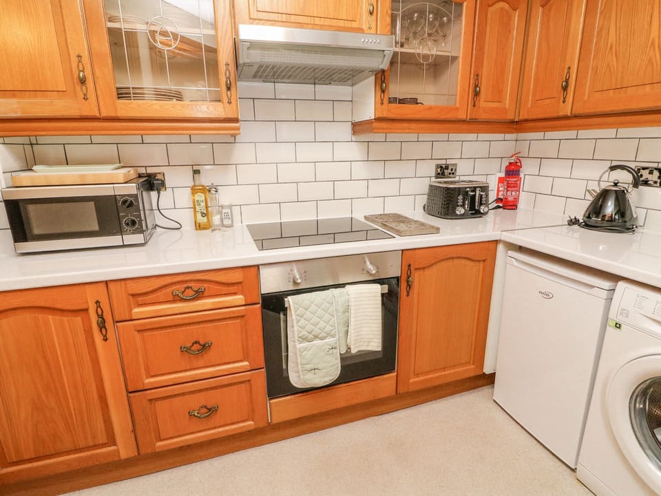 Fridge, electric kettle, toaster, cookware/dishes/utensils