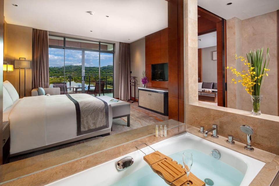 Suite, 1 Bedroom, Corner | Bathroom | Separate tub and shower, rainfall showerhead, free toiletries