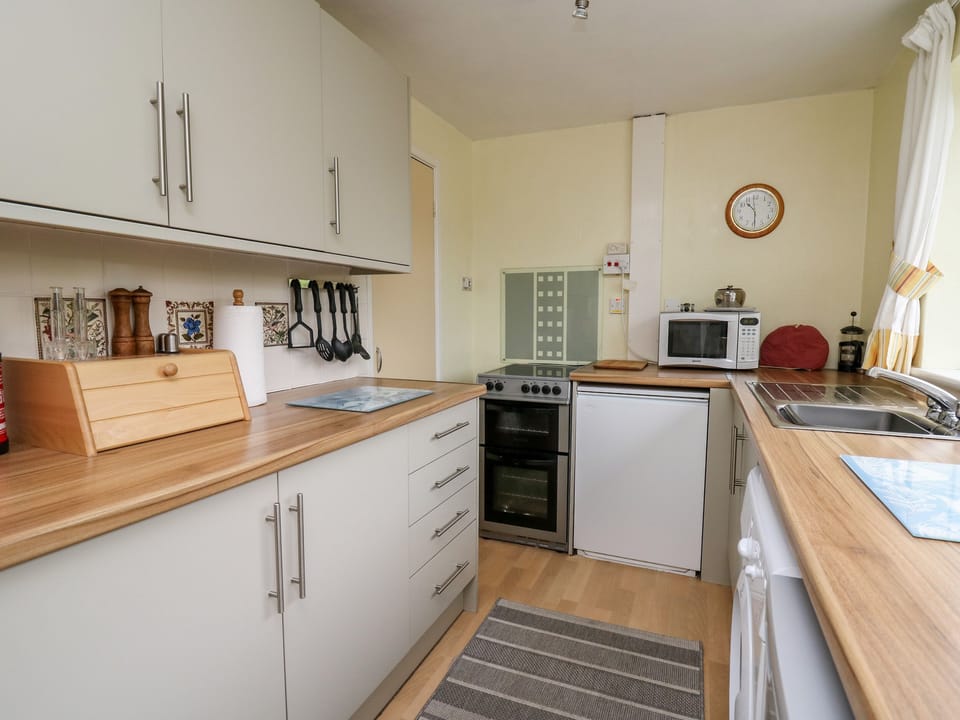 Fridge, electric kettle, toaster, cookware/dishes/utensils