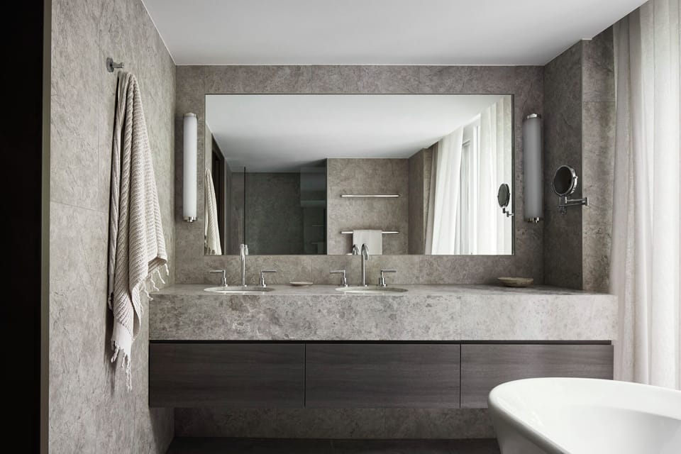 Designer toiletries, hair dryer, bathrobes, slippers