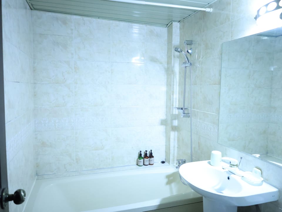 Superior Twin Room | Bathroom | Deep soaking tub, hair dryer, slippers, towels