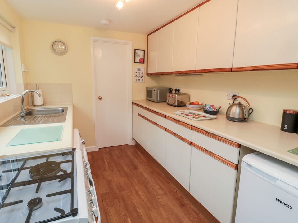 Fridge, electric kettle, toaster, cookware/dishes/utensils