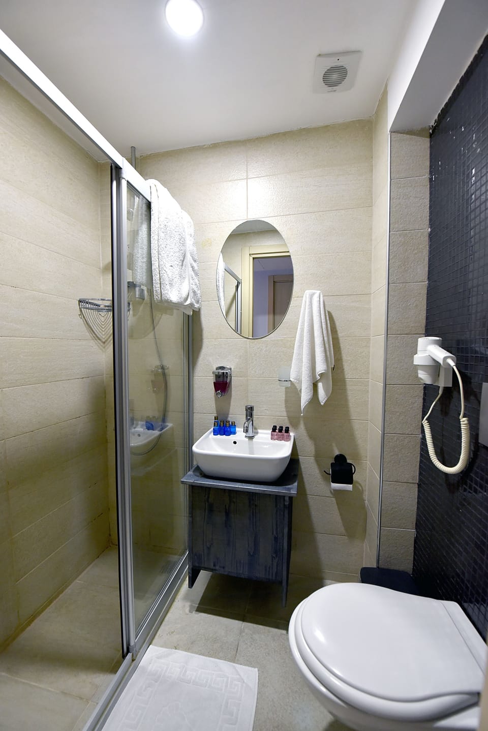 Shower, free toiletries, hair dryer, slippers