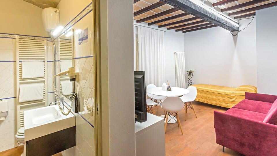 Family Apartment | Living area | 53-inch flat-screen TV with satellite channels, DVD player, pay movies
