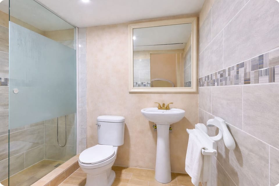 Shower, rainfall showerhead, hair dryer, towels