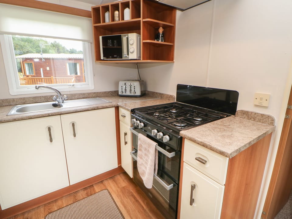 Fridge, electric kettle, toaster, cookware/dishes/utensils