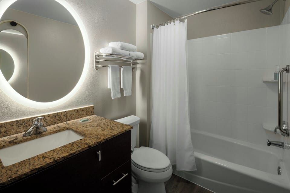 Combined shower/tub, designer toiletries, hair dryer, towels
