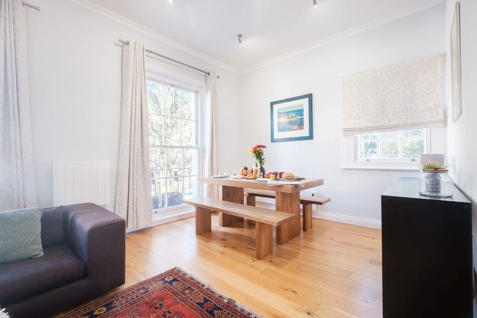 City Apartment | Living area | 40-inch flat-screen TV with satellite channels, TV