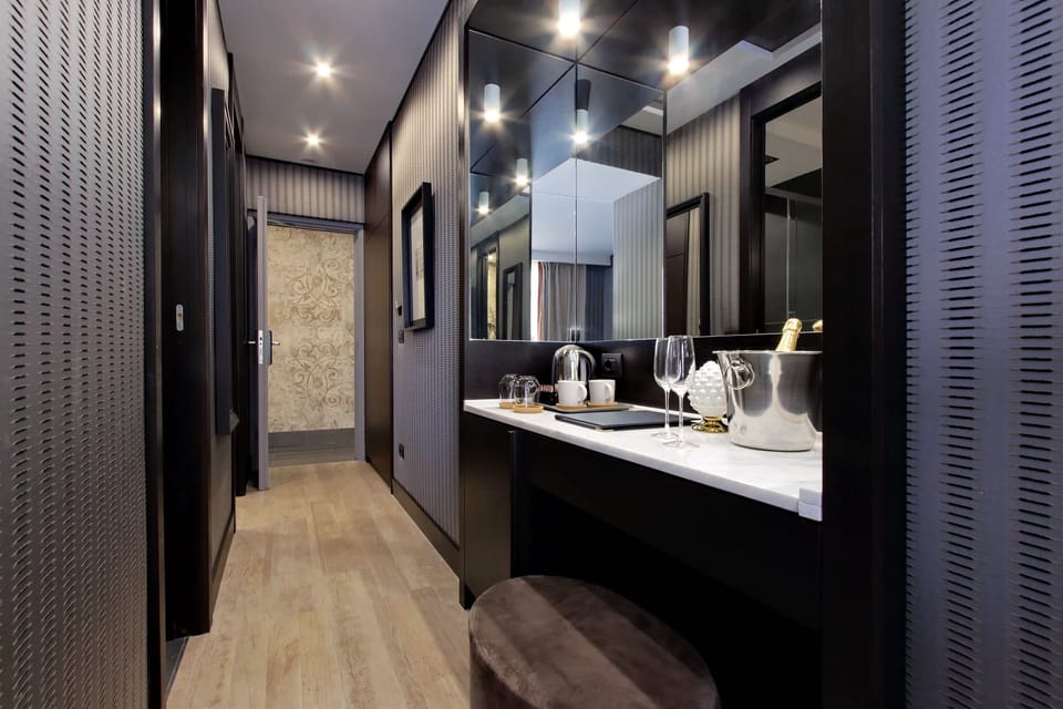 Exclusive Triple Room | Minibar, in-room safe, laptop workspace, blackout drapes