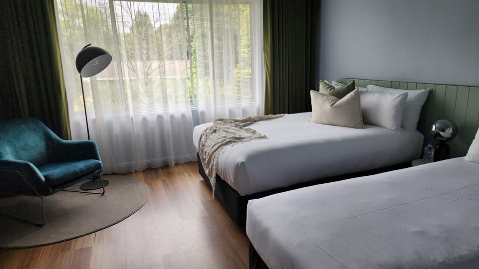 Queen Plus One | Premium bedding, blackout drapes, iron/ironing board, WiFi (free)