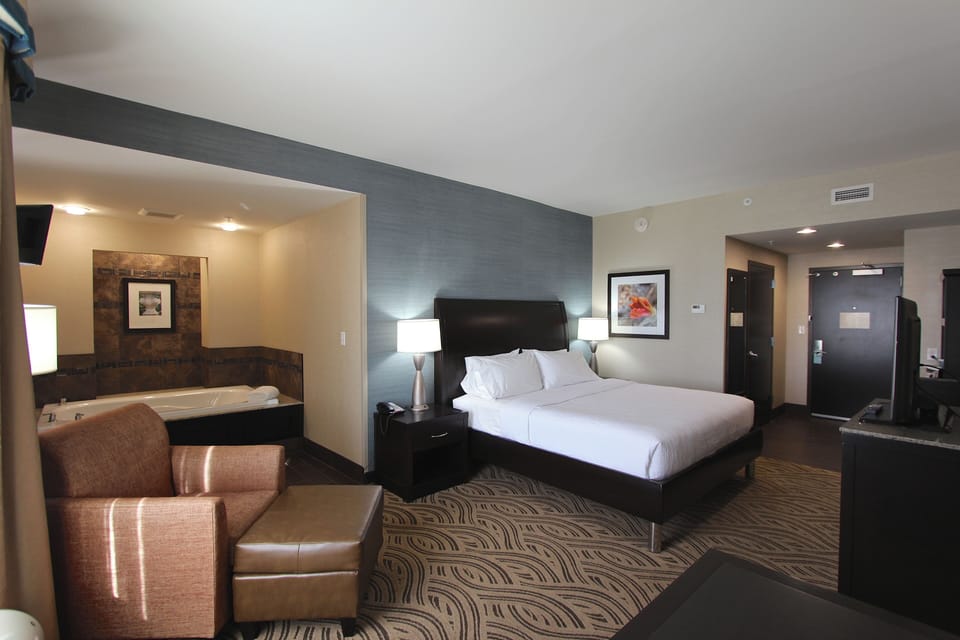 Premium bedding, desk, laptop workspace, blackout drapes