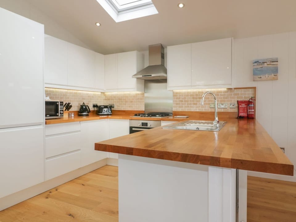 Fridge, dishwasher, electric kettle, cookware/dishes/utensils