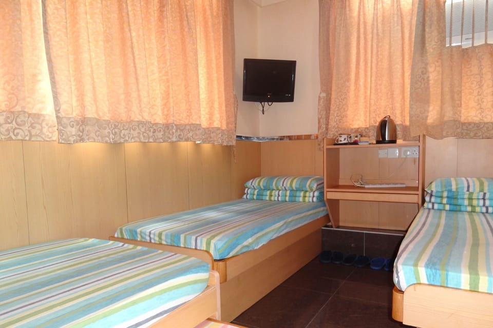 Quadruple Room | Select Comfort beds, soundproofing, iron/ironing board, free WiFi