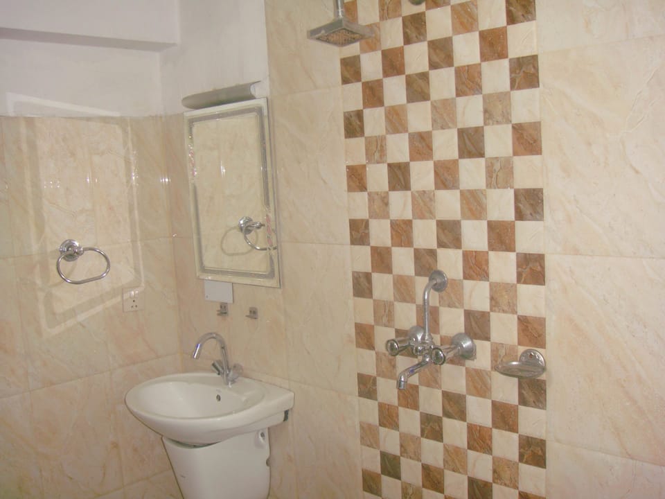 Family Triple Room, Private Bathroom | Bathroom amenities | Combined shower/tub, hair dryer, towels