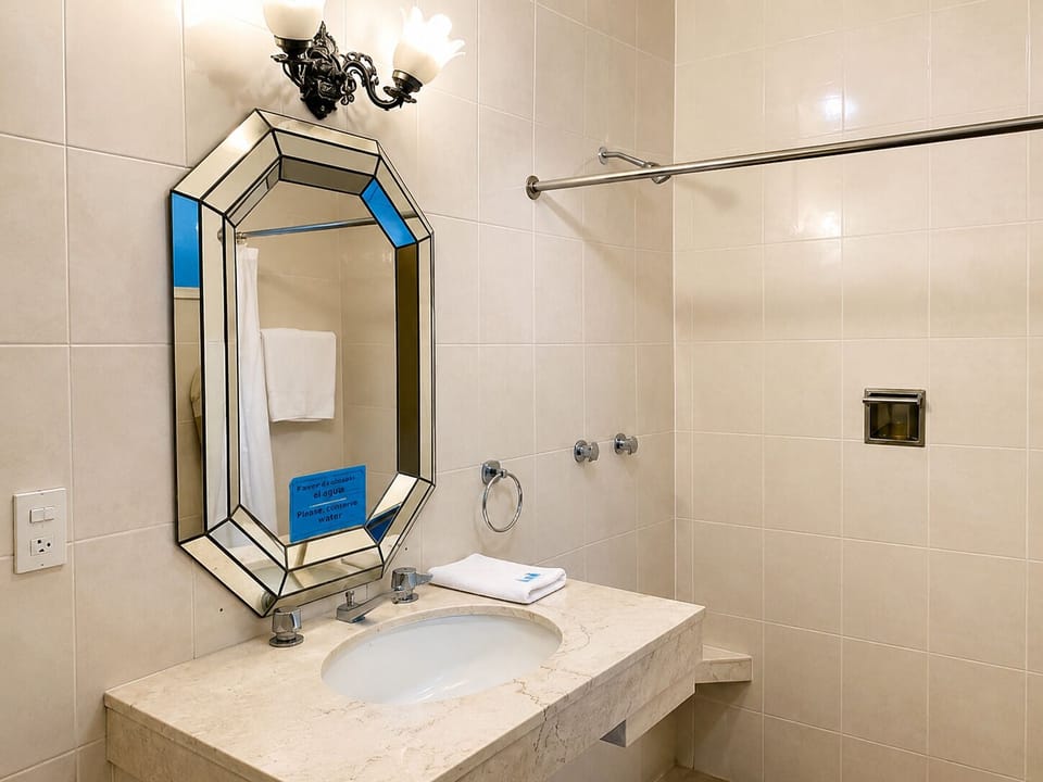 Basic Double Room, 2 Double Beds | Bathroom | Shower, rainfall showerhead, free toiletries, towels