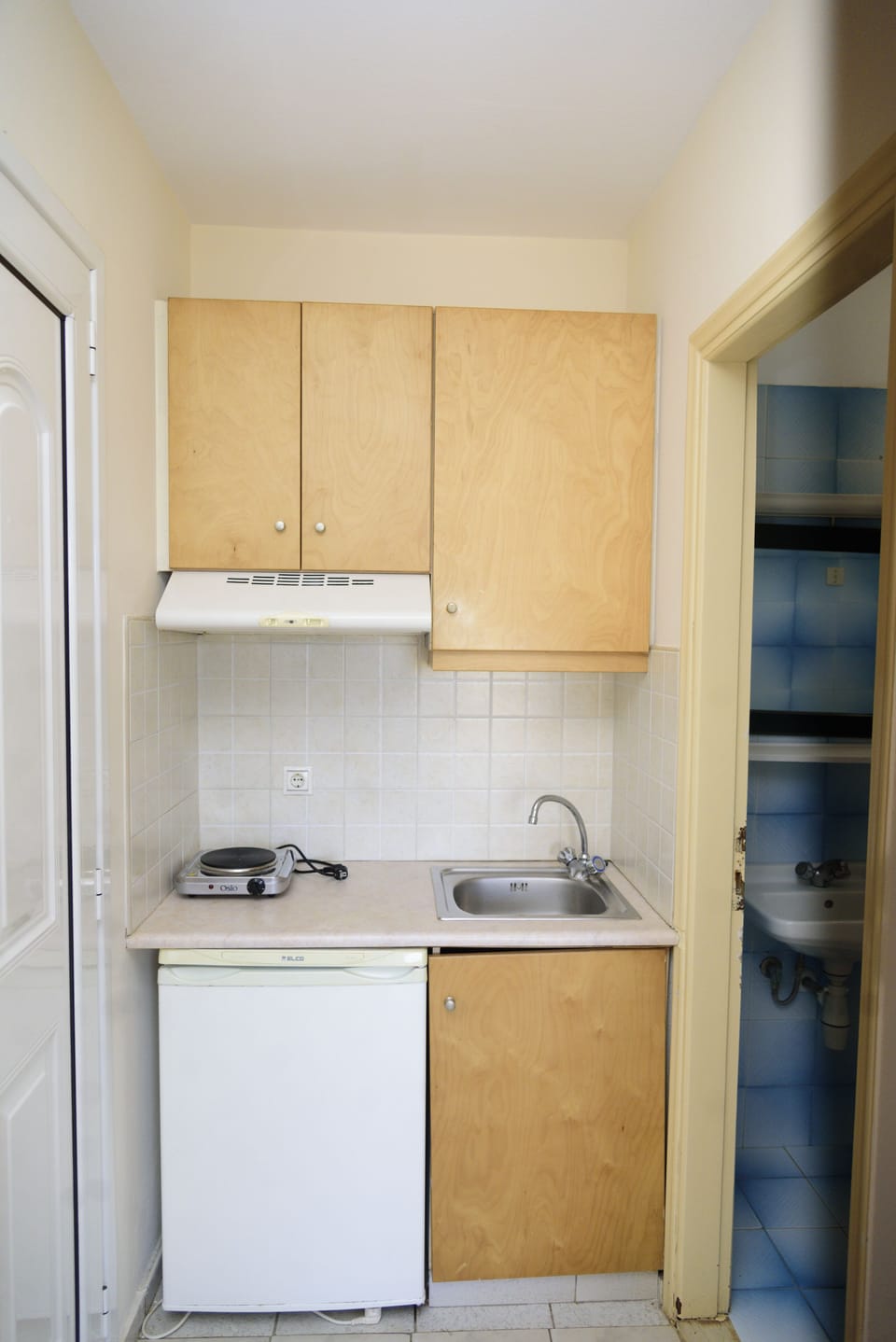 Mini-fridge, stovetop, toaster, dining tables