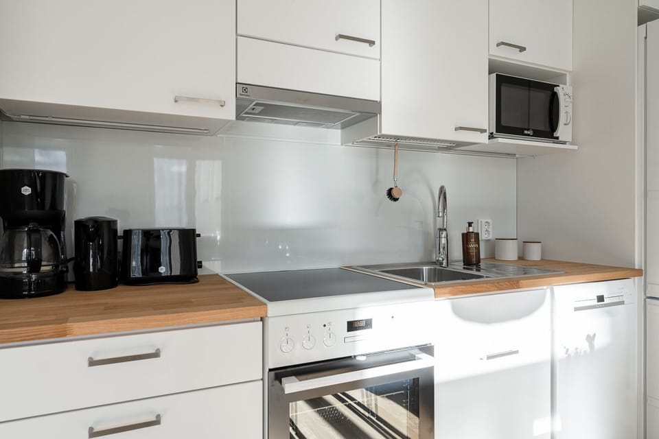 Exclusive Apartment | Private kitchen | Full-size fridge, microwave, oven, stovetop