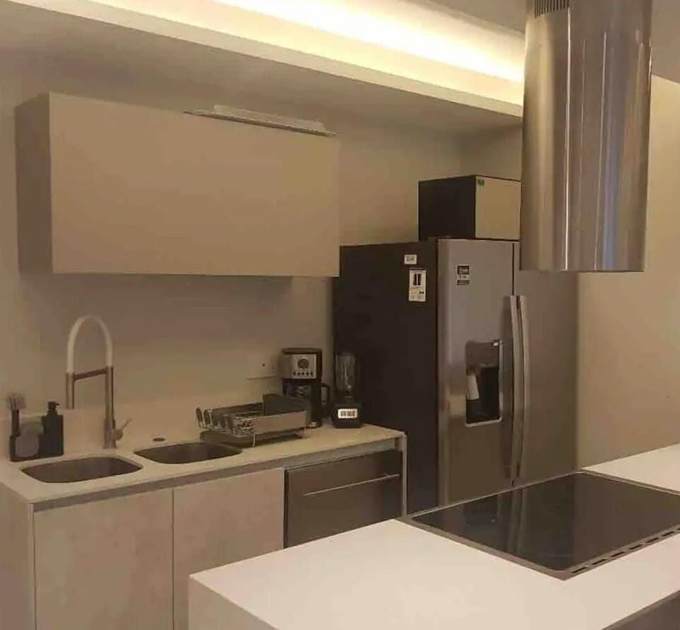 Family Condo | Private kitchen | Cookware/dishes/utensils, dining tables