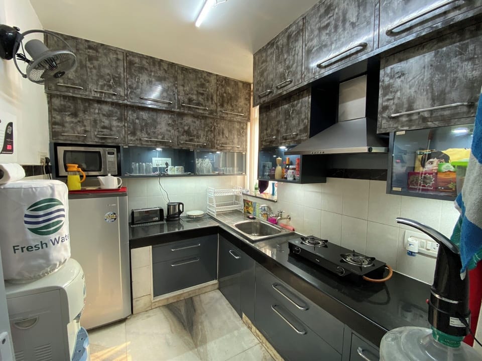 Apartment, 2 Bedrooms, Smoking, Balcony | Private kitchen | Coffee/tea maker, electric kettle, dining tables
