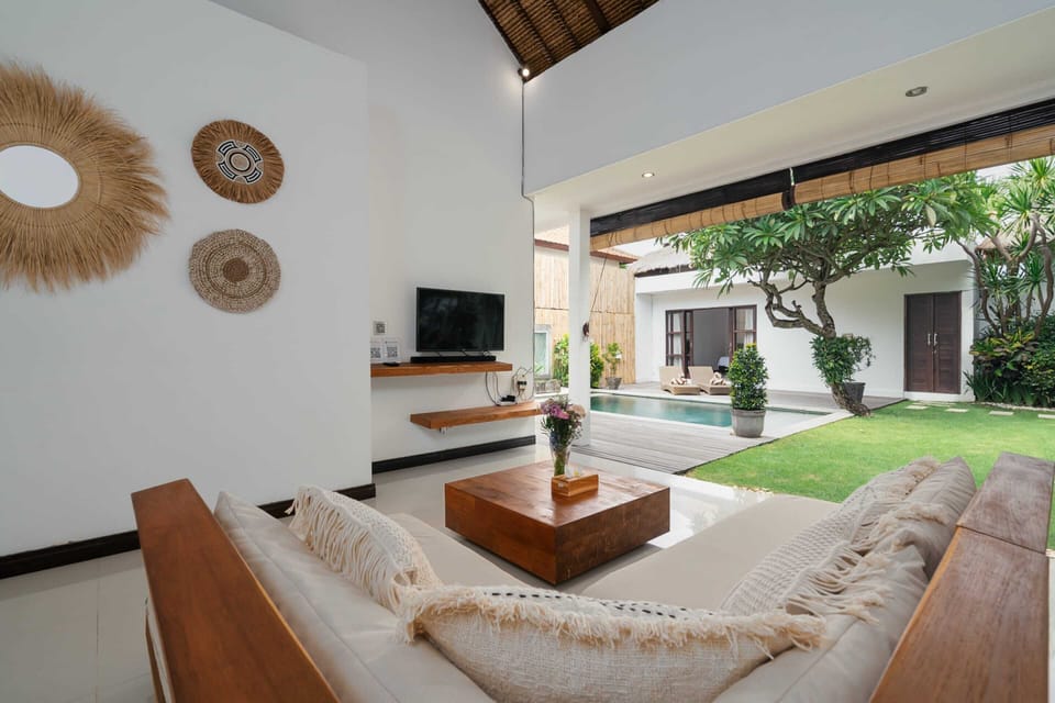 Basic Villa, 2 Queen Beds | Living area | 32-inch TV with cable channels