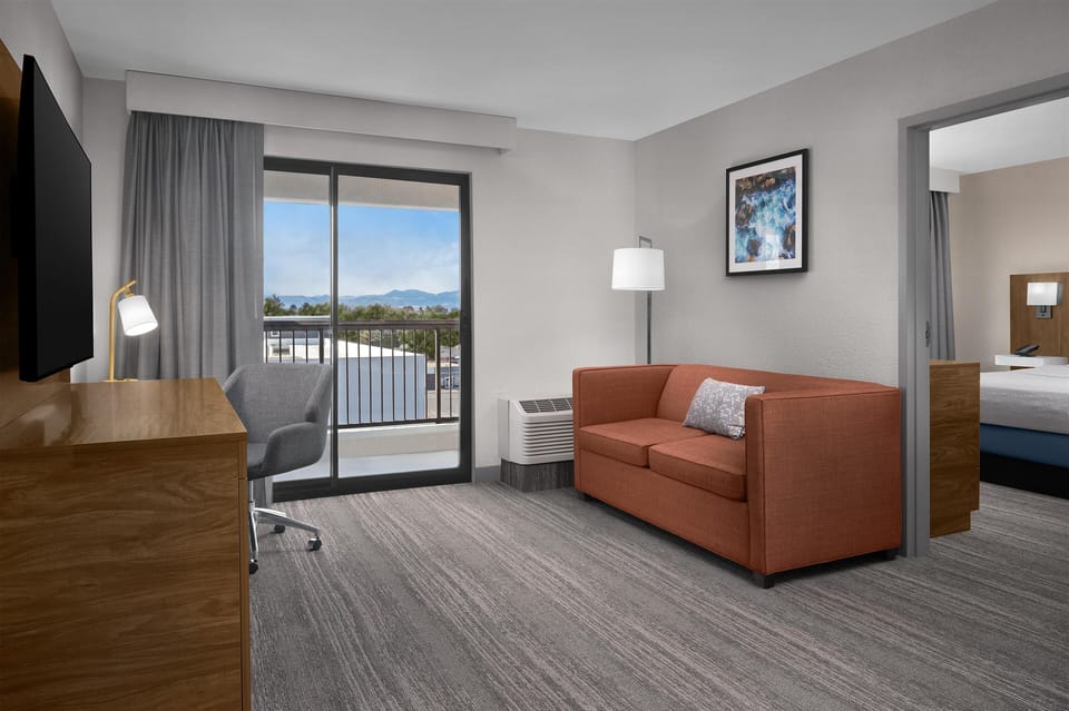 Suite, 1 King Bed, Balcony, Mountain View | Living area | 55-inch flat-screen TV with cable channels, TV