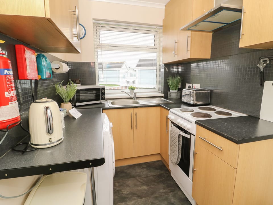 Fridge, electric kettle, toaster, cookware/dishes/utensils