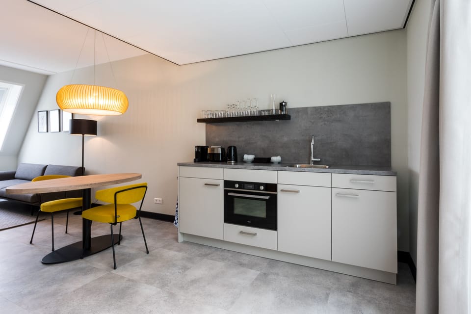 Junior Suite - no pets allowed | Living area | Flat-screen TV