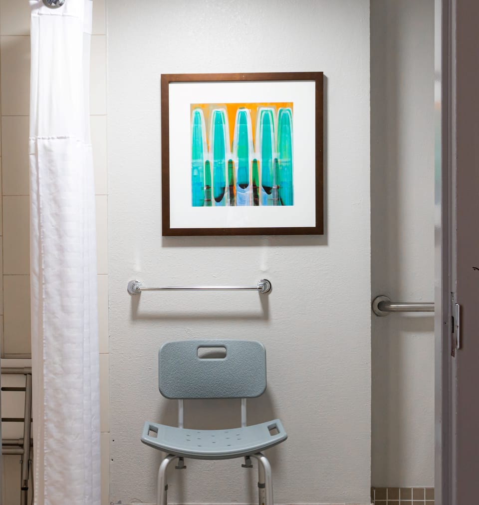 Designer toiletries, hair dryer, towels