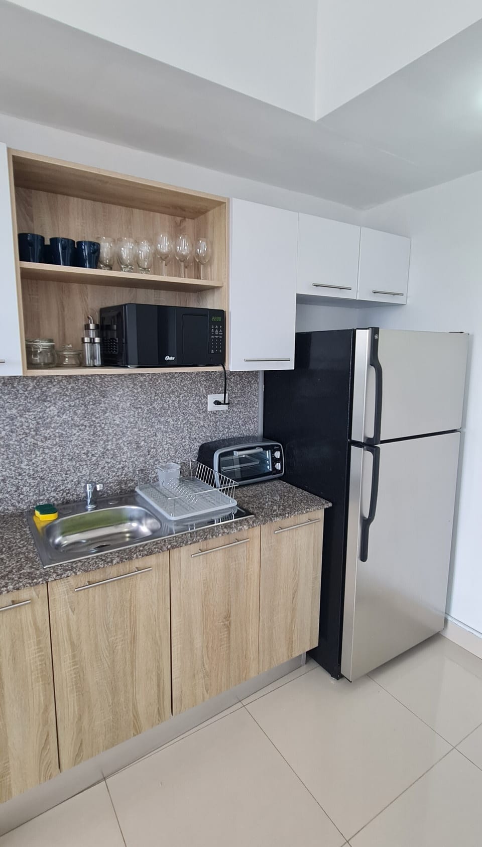 Comfort Apartment | Private kitchen | Full-size fridge, microwave, oven, stovetop