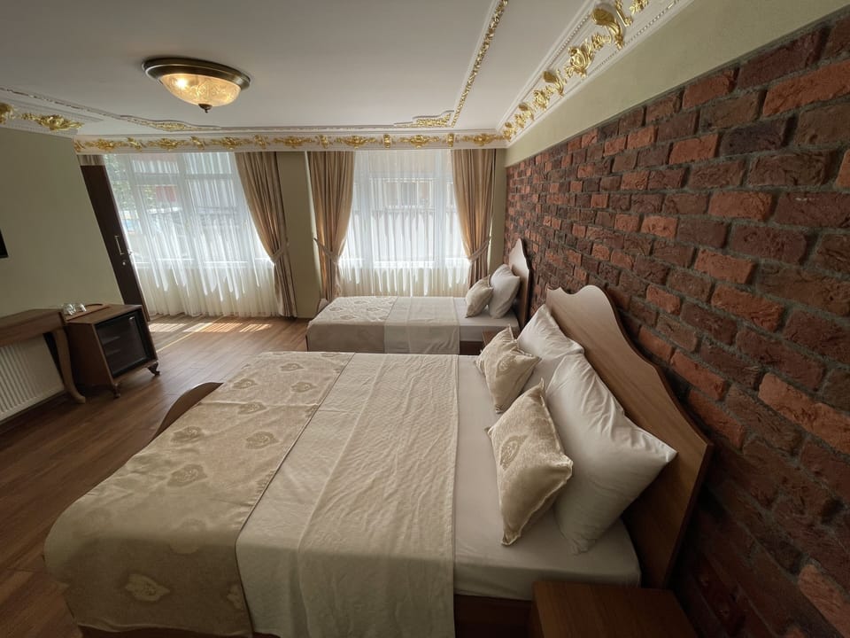 Deluxe Triple Room | Frette Italian sheets, premium bedding, minibar, iron/ironing board