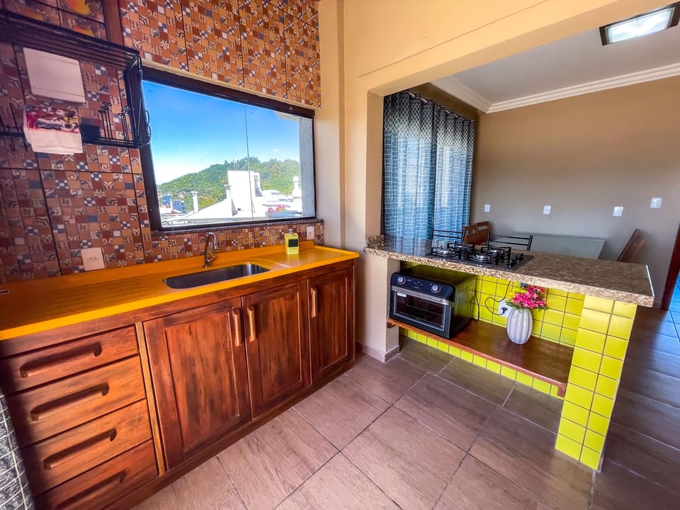 Deluxe Apartment | Private kitchen | Full-size fridge, microwave, stovetop, toaster oven