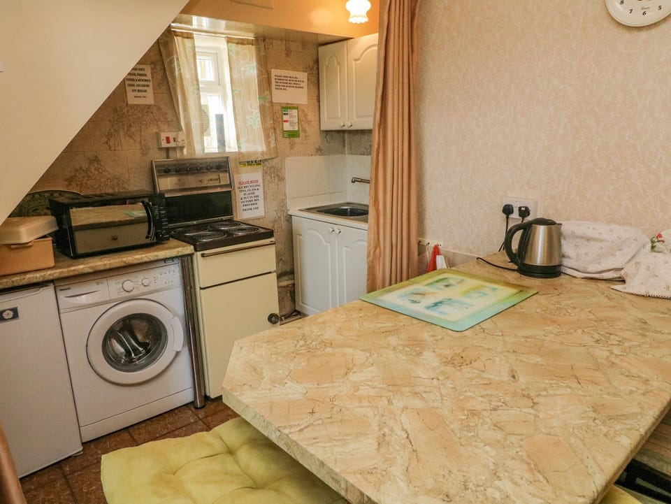 Fridge, electric kettle, toaster, cookware/dishes/utensils