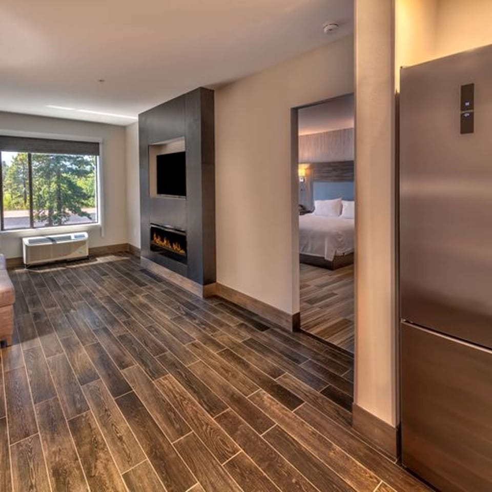 Suite, 1 King Bed, Accessible (Mobility & Hearing, Roll-in Shower) | In-room safe, desk, blackout drapes, iron/ironing board