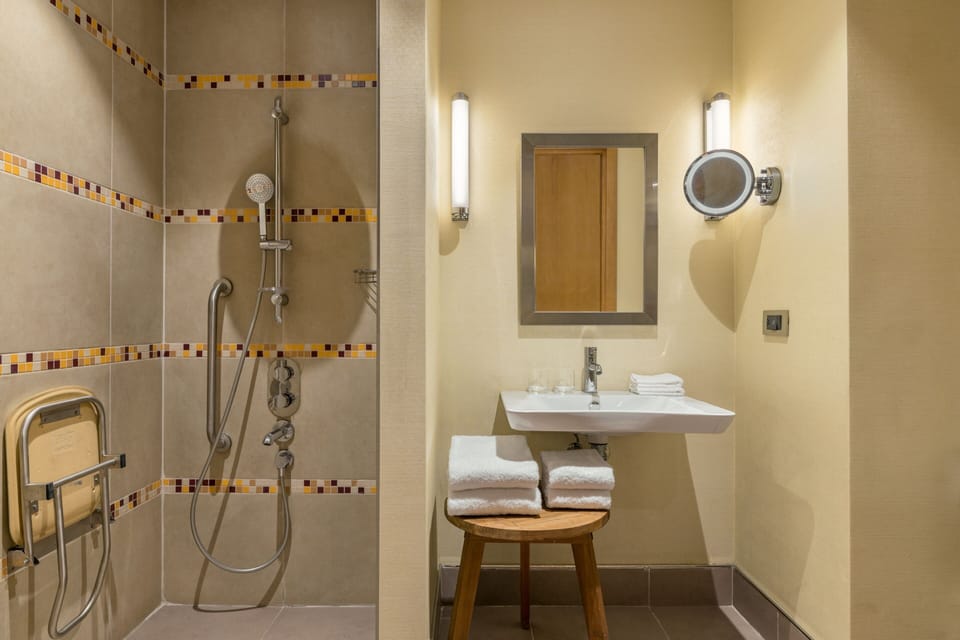 Separate tub and shower, rainfall showerhead, free toiletries