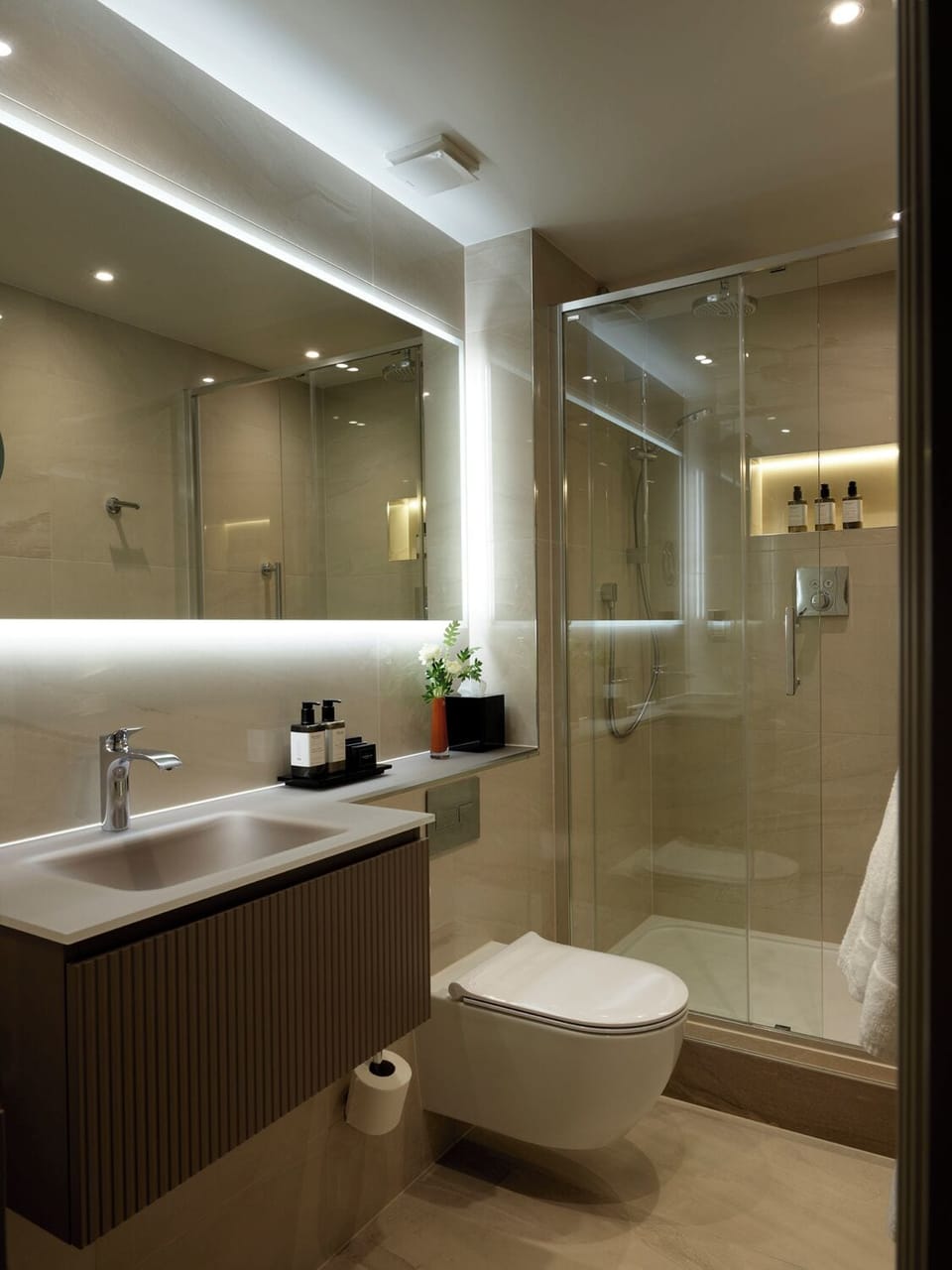 Designer toiletries, hair dryer, towels