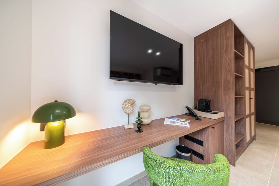 Deluxe Double Room, 1 Queen Bed, Terrace | Living area | Flat-screen TV