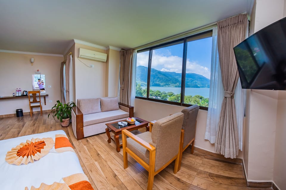 Standard Suite, Lake View | Down comforters, in-room safe, individually furnished, desk