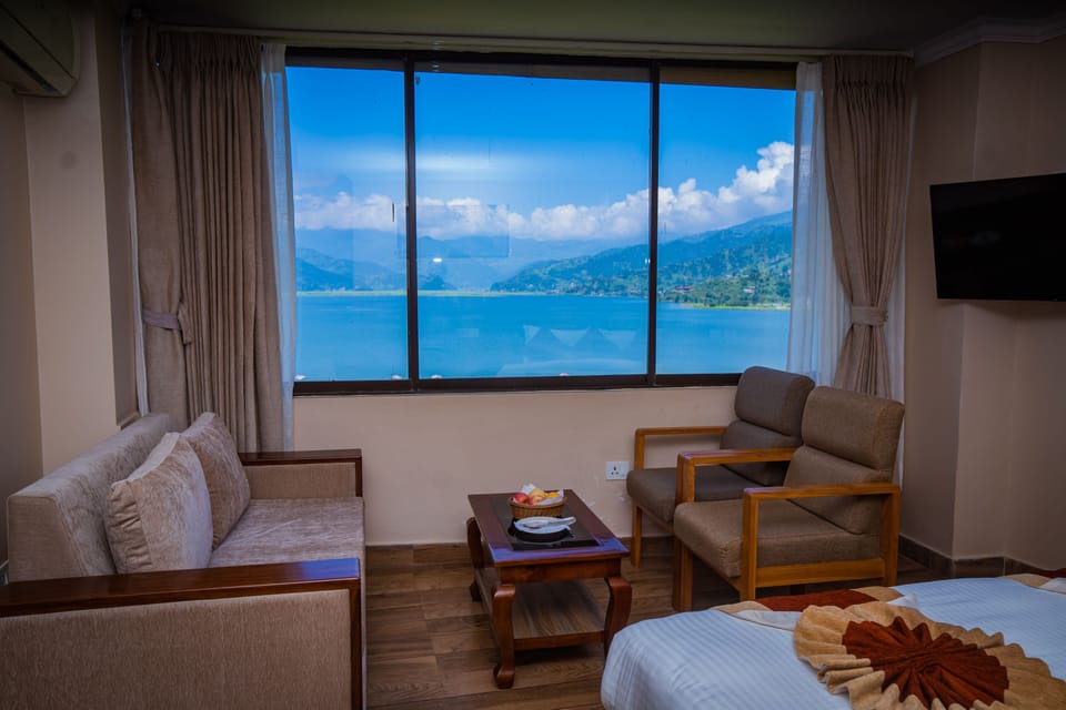Standard Suite, Lake View | Down comforters, in-room safe, individually furnished, desk